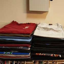 Neatly-folded T-shirt stacks a shelf after using the closet organizer *and* shirt folder