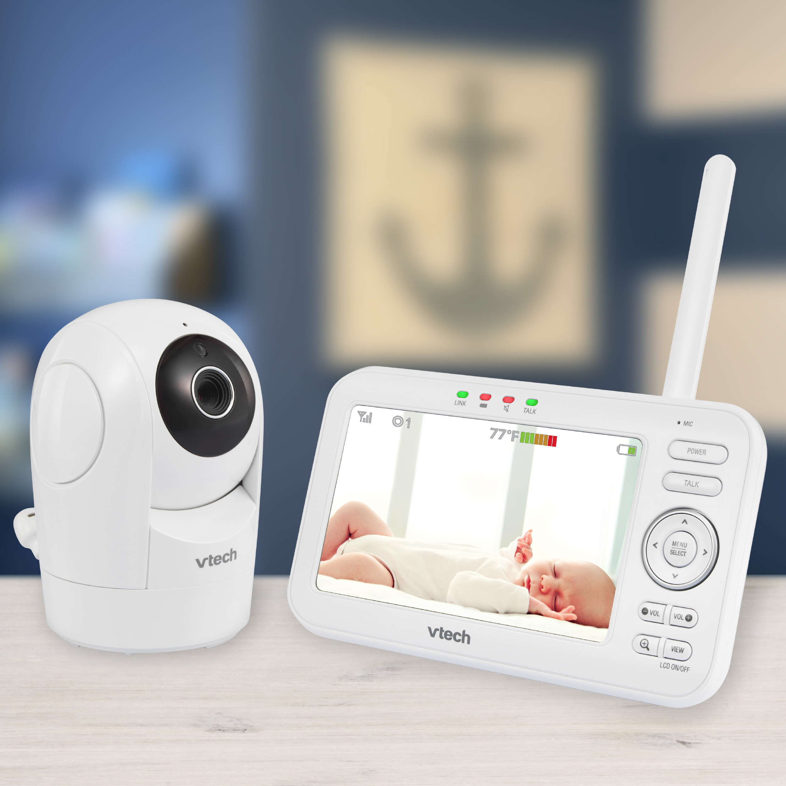 a white v-tech baby camera with a portable monitor