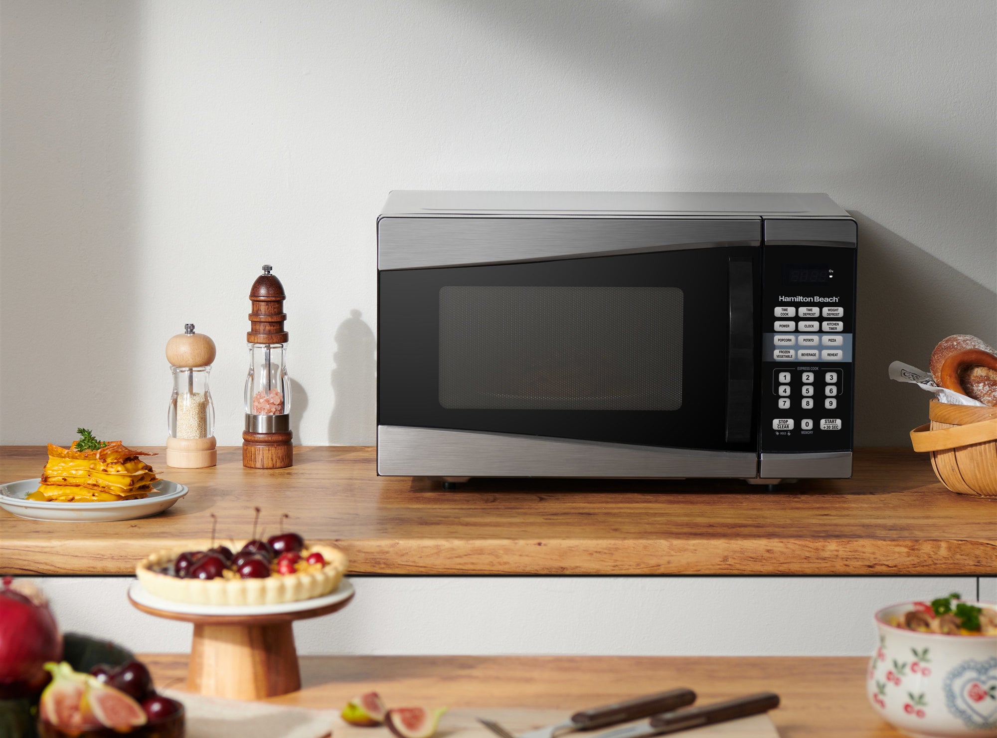 black hamilton beach microwave on a kitchen counter top