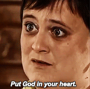 A woman saying &quot;Put God in your heart&quot;
