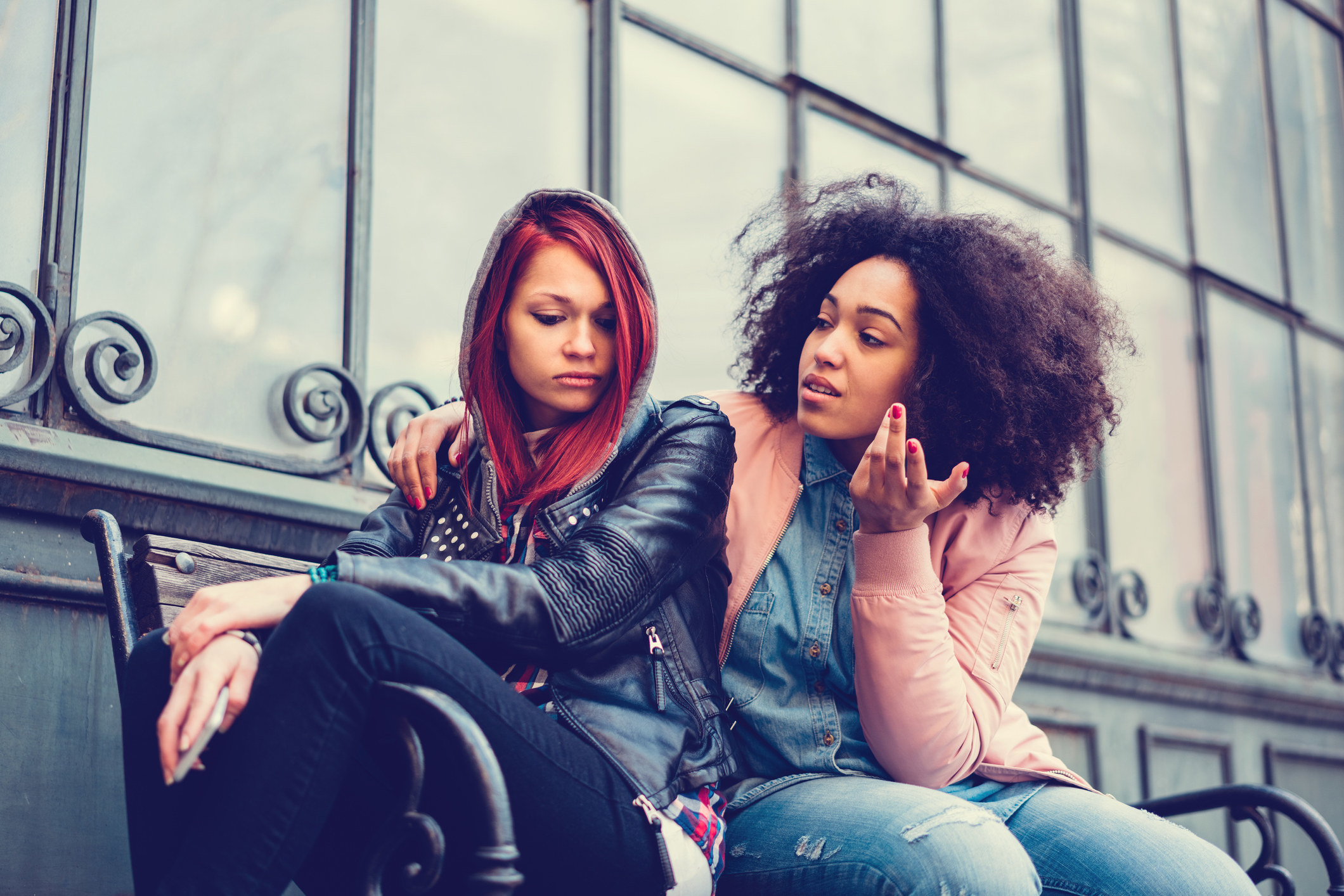 A friend comforting another woman