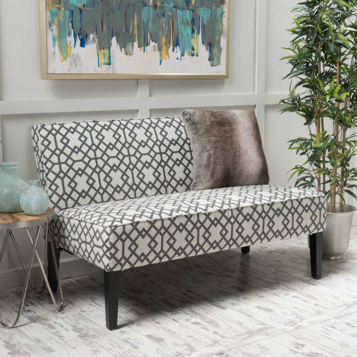 A gray patterned loveseat