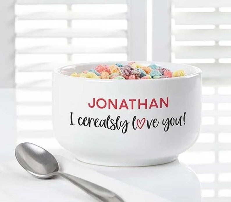 The white cereal bowl that reads &quot;Jonathan I cerealsly love you!&quot;