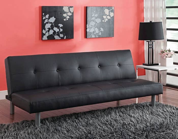 A black faux leather futon