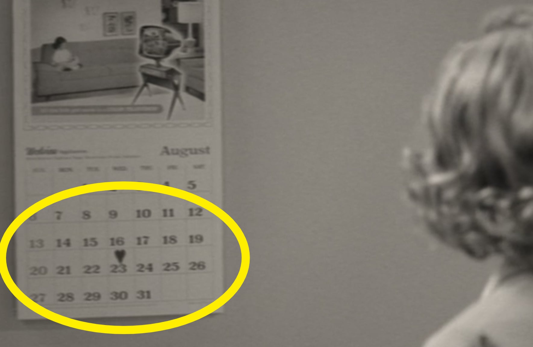 Wanda looking at a calendar with a heart on Aug. 23