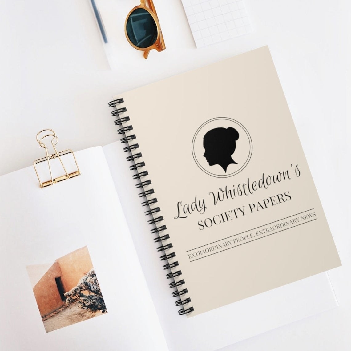 The notebook surrounded by sheets of paper