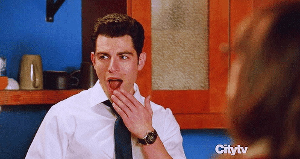 GIf of Nick and Schmidt from New Girl looking shocked and pleased 