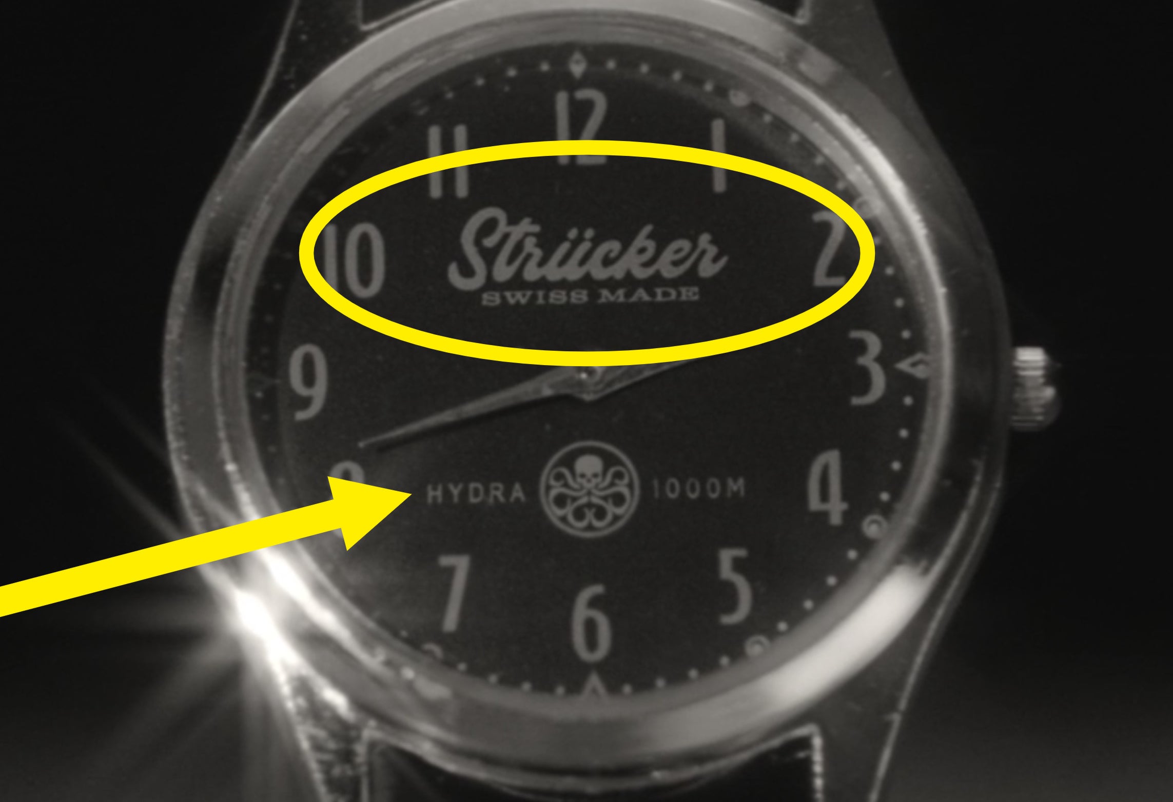 A close-up of the Strucker watch that also says Hydra and has the Hydra logo