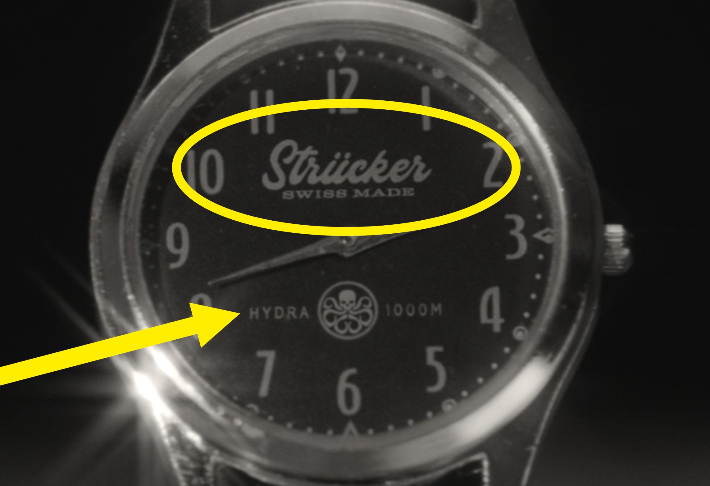 A close-up of the Strucker watch that also says Hydra and has the Hydra logo