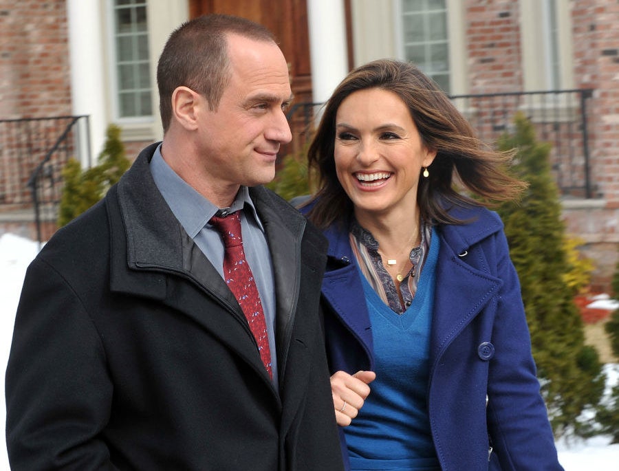 Mariska Hargitay and Chris Meloni walking hand-in-hand on the set of SVU