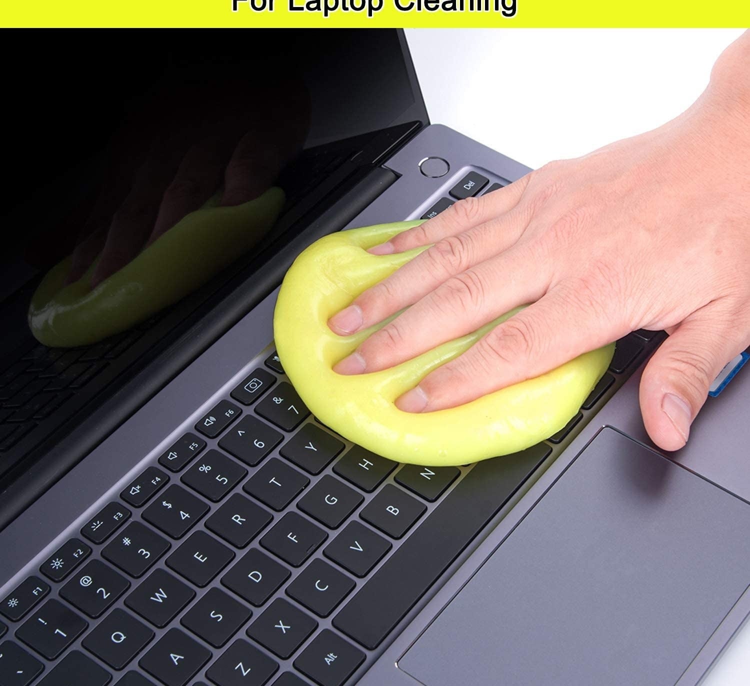 Model using cleaning putty on laptop keyboard