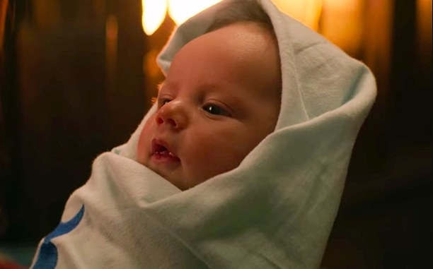 A baby wrapped in cloth
