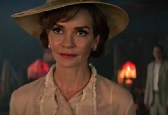Prudence disguised as Penelope Blossom, wearing a blouse a hat