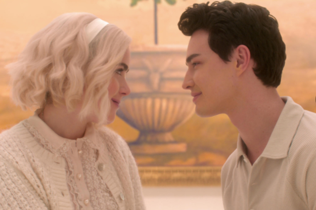 Sabrina and Nick wear white and stare at each other lovingly