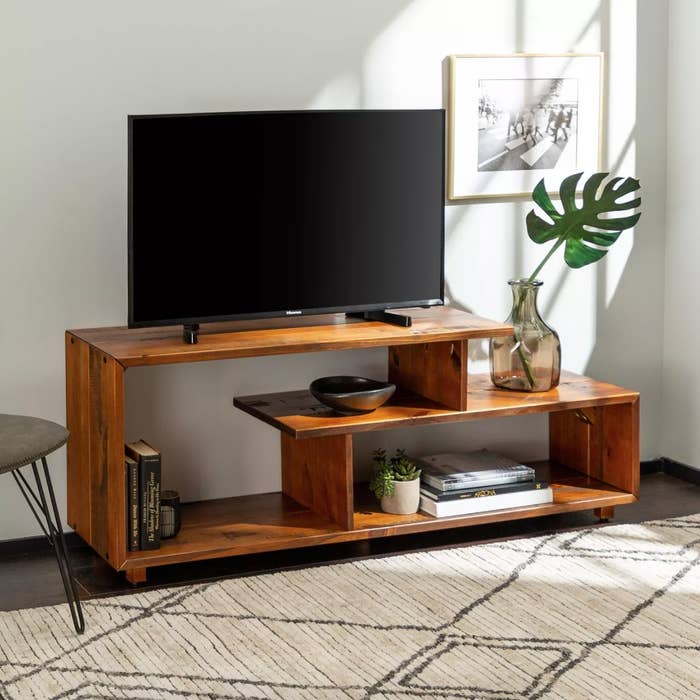 An open shelf wooden TV stand