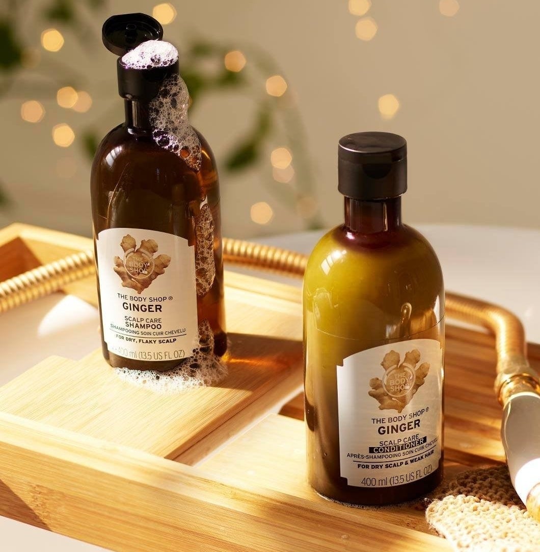 The shampoo and conditioner on a bathroom tray