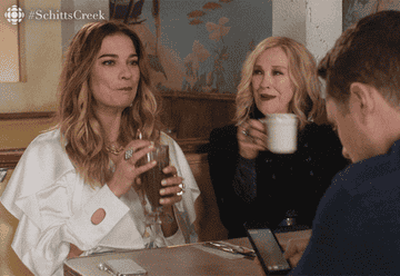 catherine o&#x27;hara and annie murphy cheers in &quot;schitt&#x27;s creek&quot;
