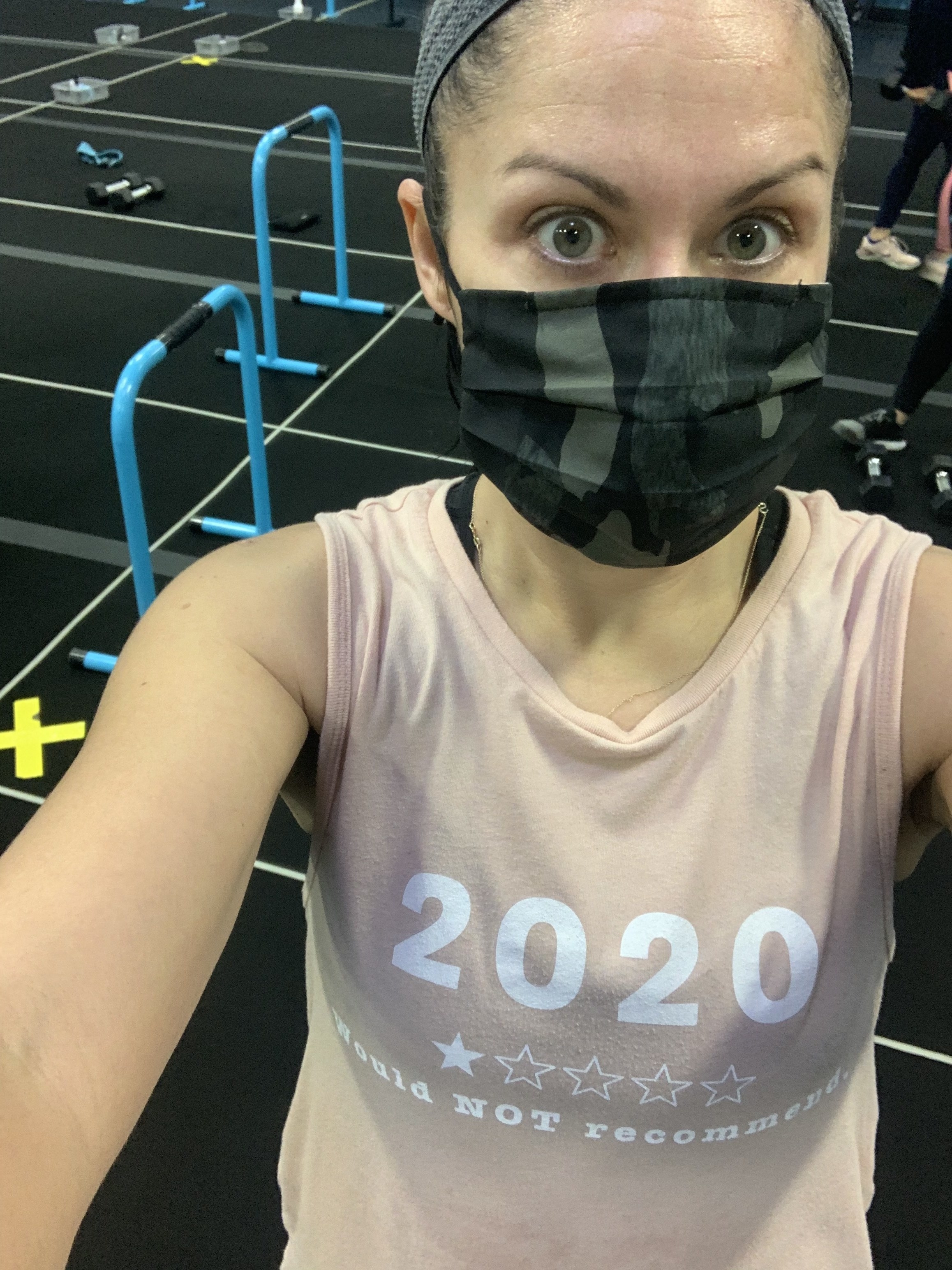 The author in a mask at her local gym