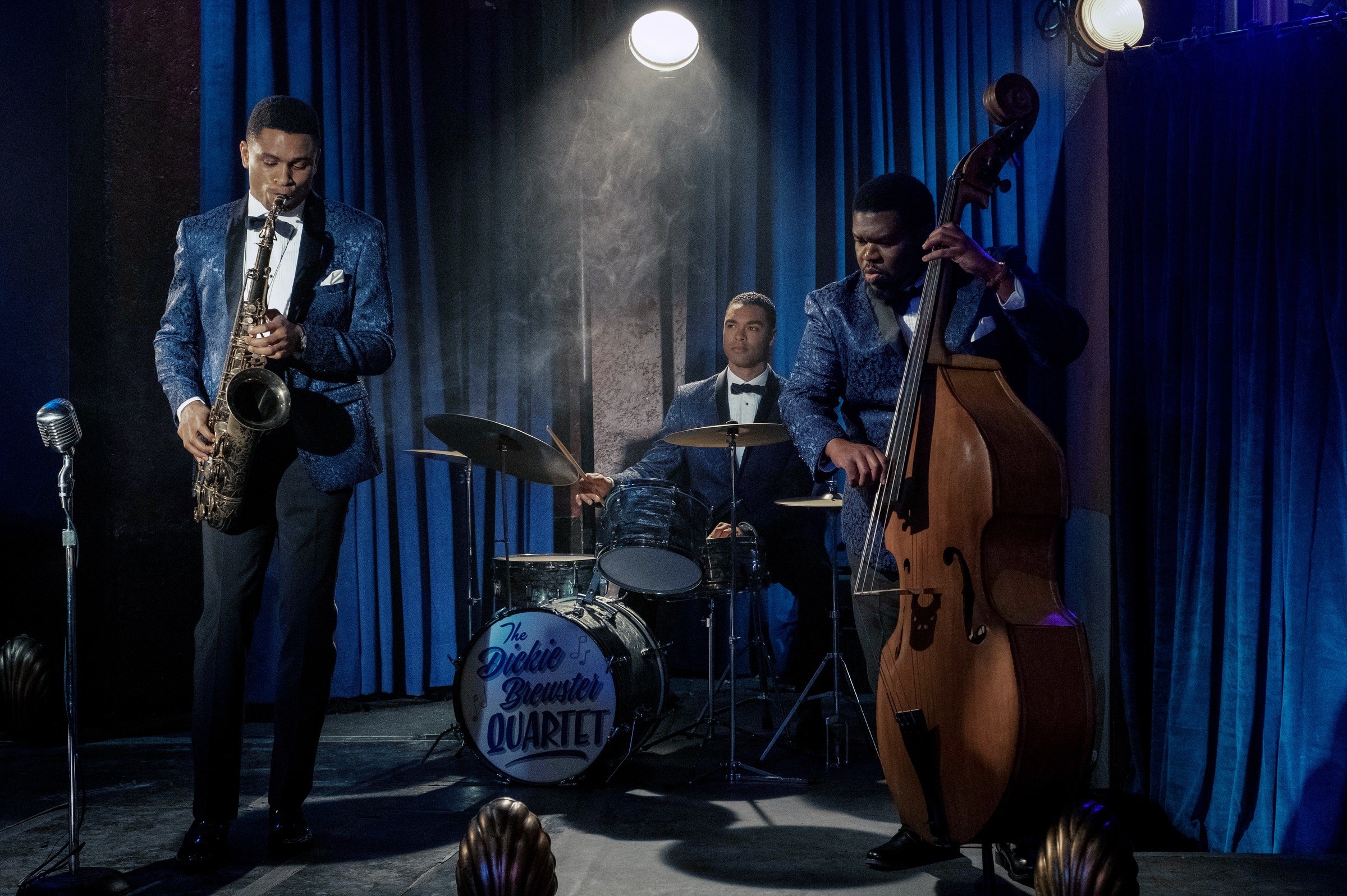 Three men playing instruments
