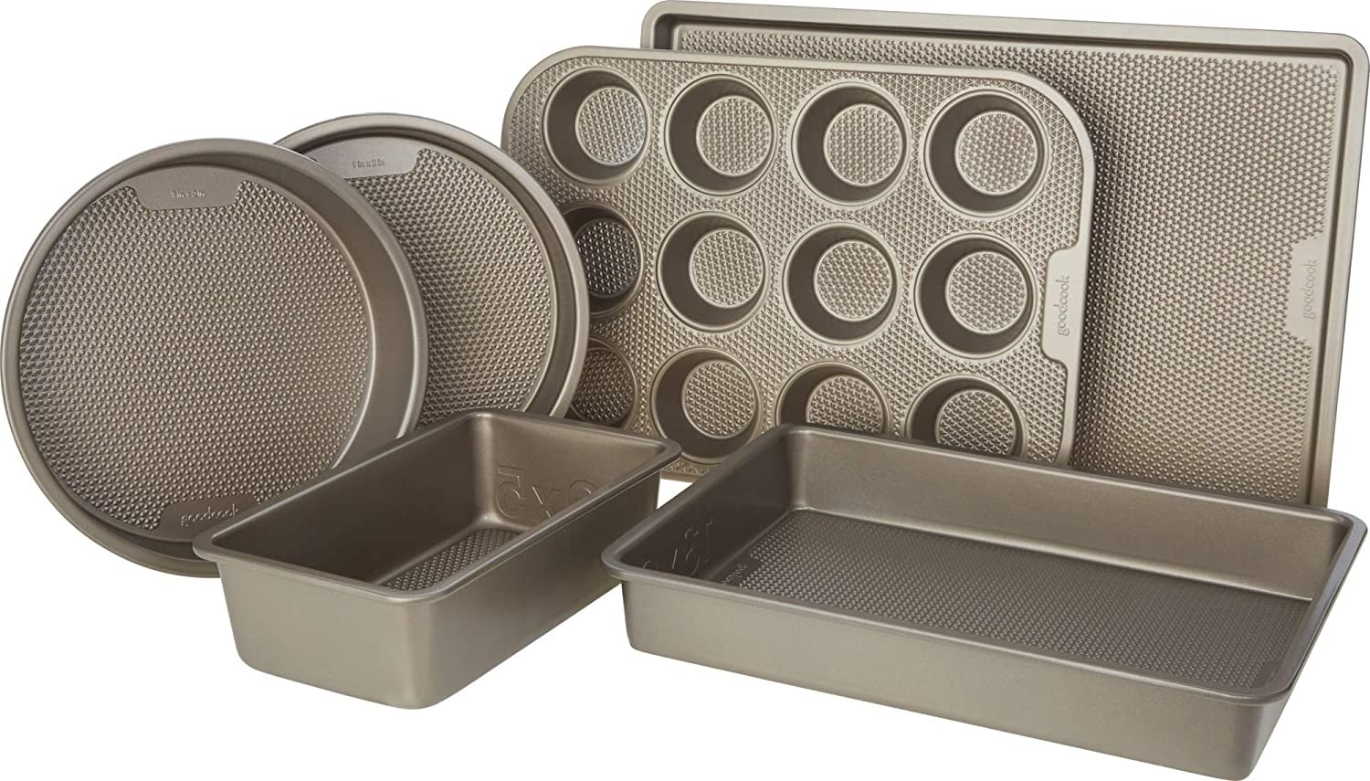 Two round cake pans, a cookie sheet, a muffin tin, a loaf pan, and a rectangular cake pan