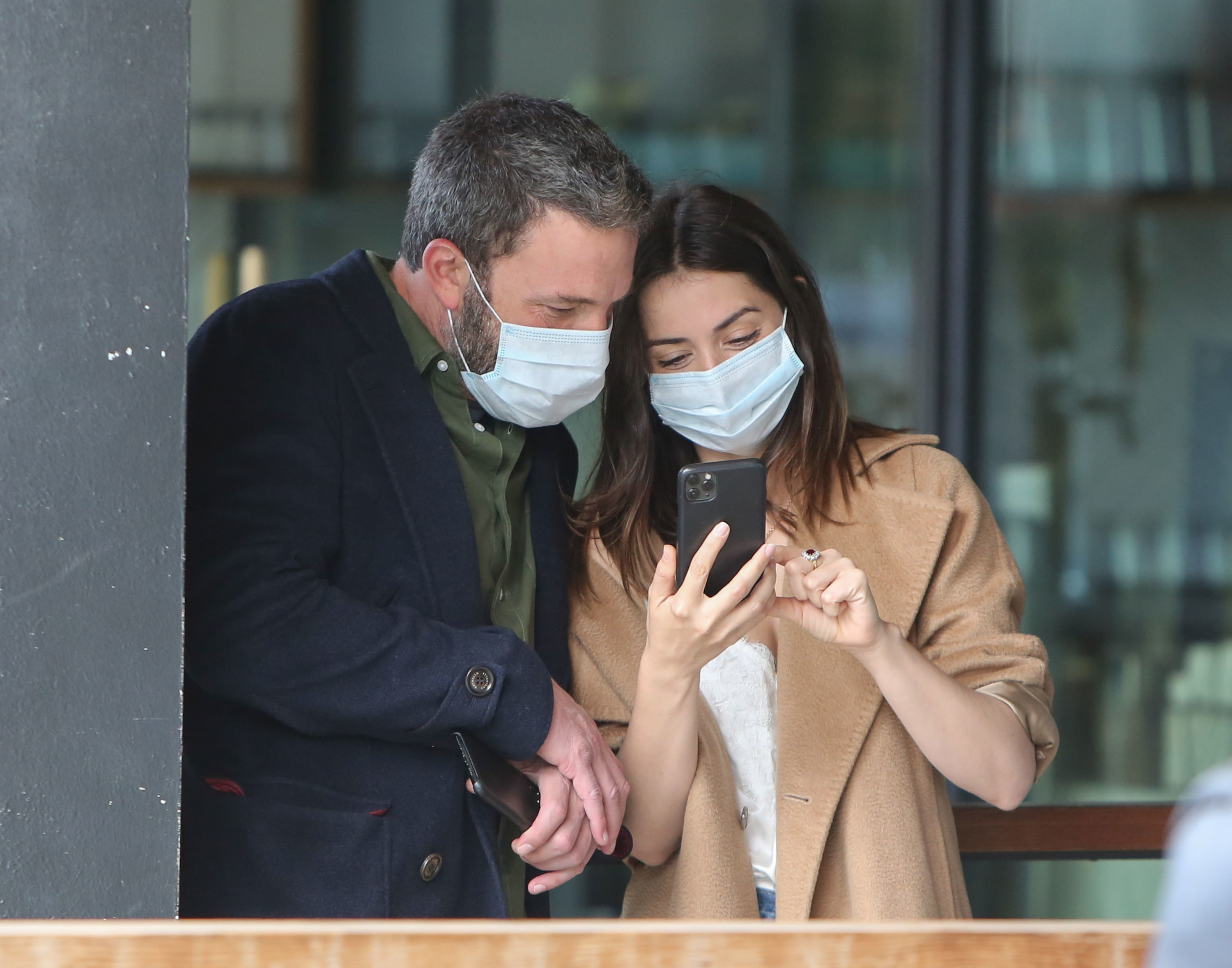 Ben Affleck and Ana de Armas taking pics together while wearing face masks