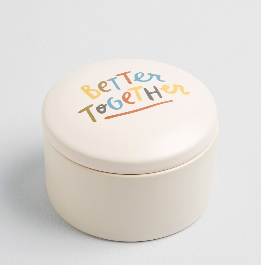 Round, lidded dish with painted words that say "Better Together"