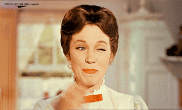 A gif of Julie Andrews as Mary Poppins snapping her fingers and winking