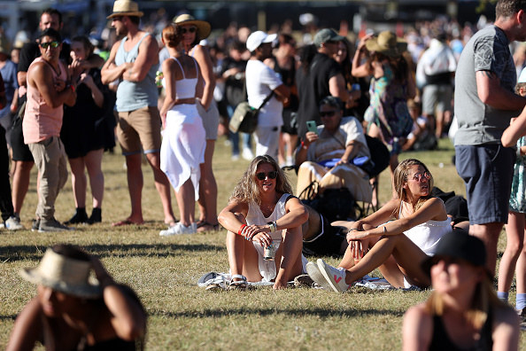 People walking around and chilling in a open space 