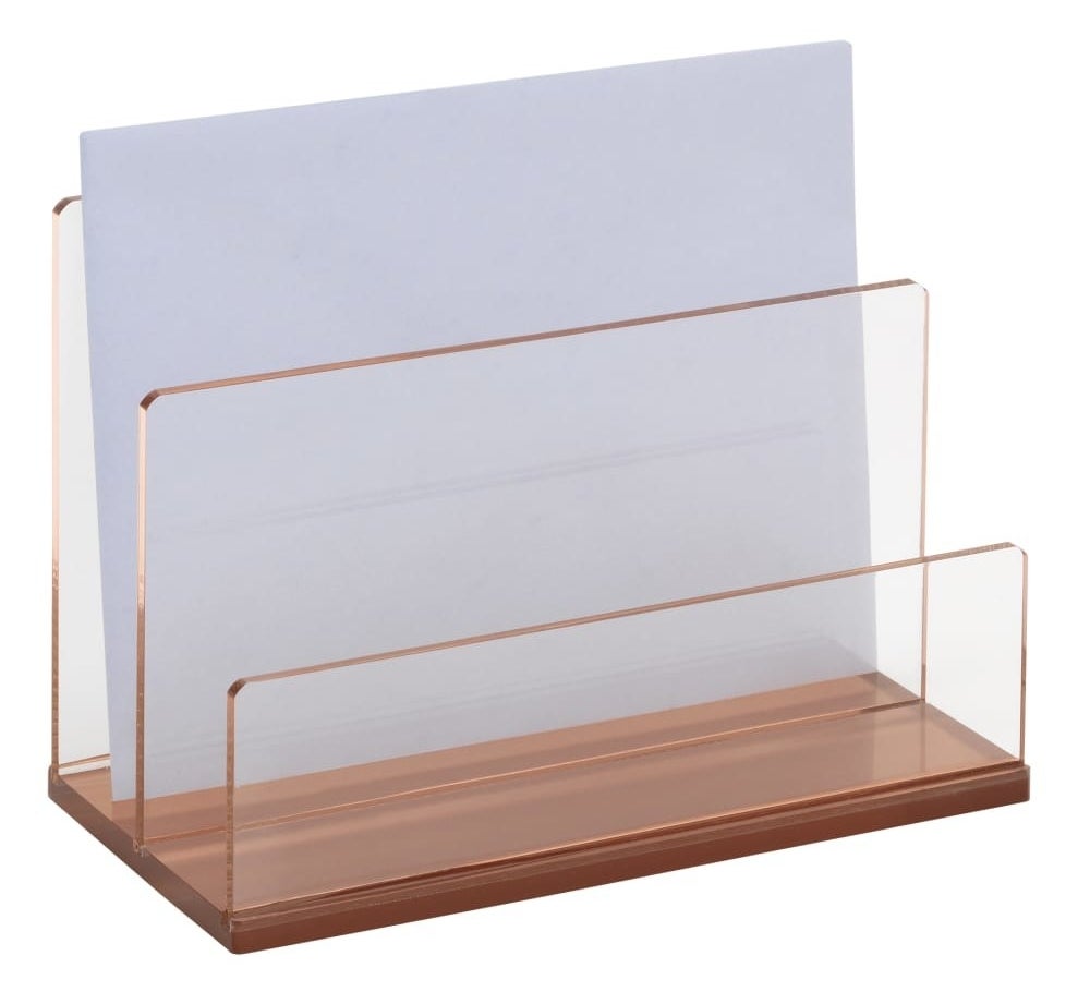 The rose gold organizer which has two acrylic dividers