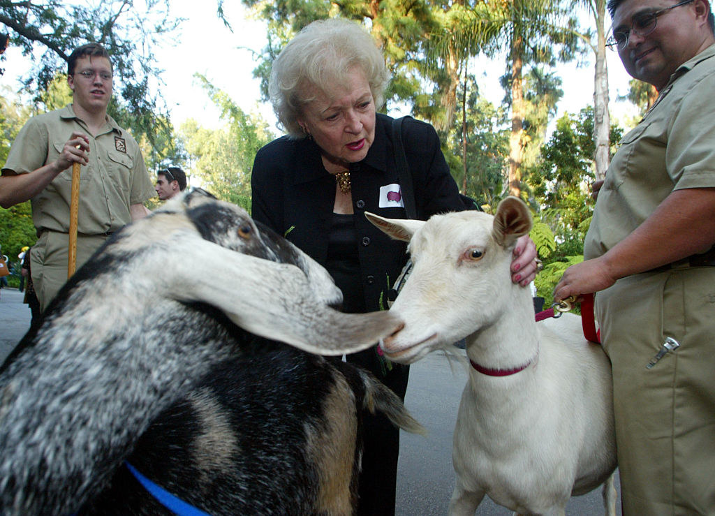 Betty White petting two goats