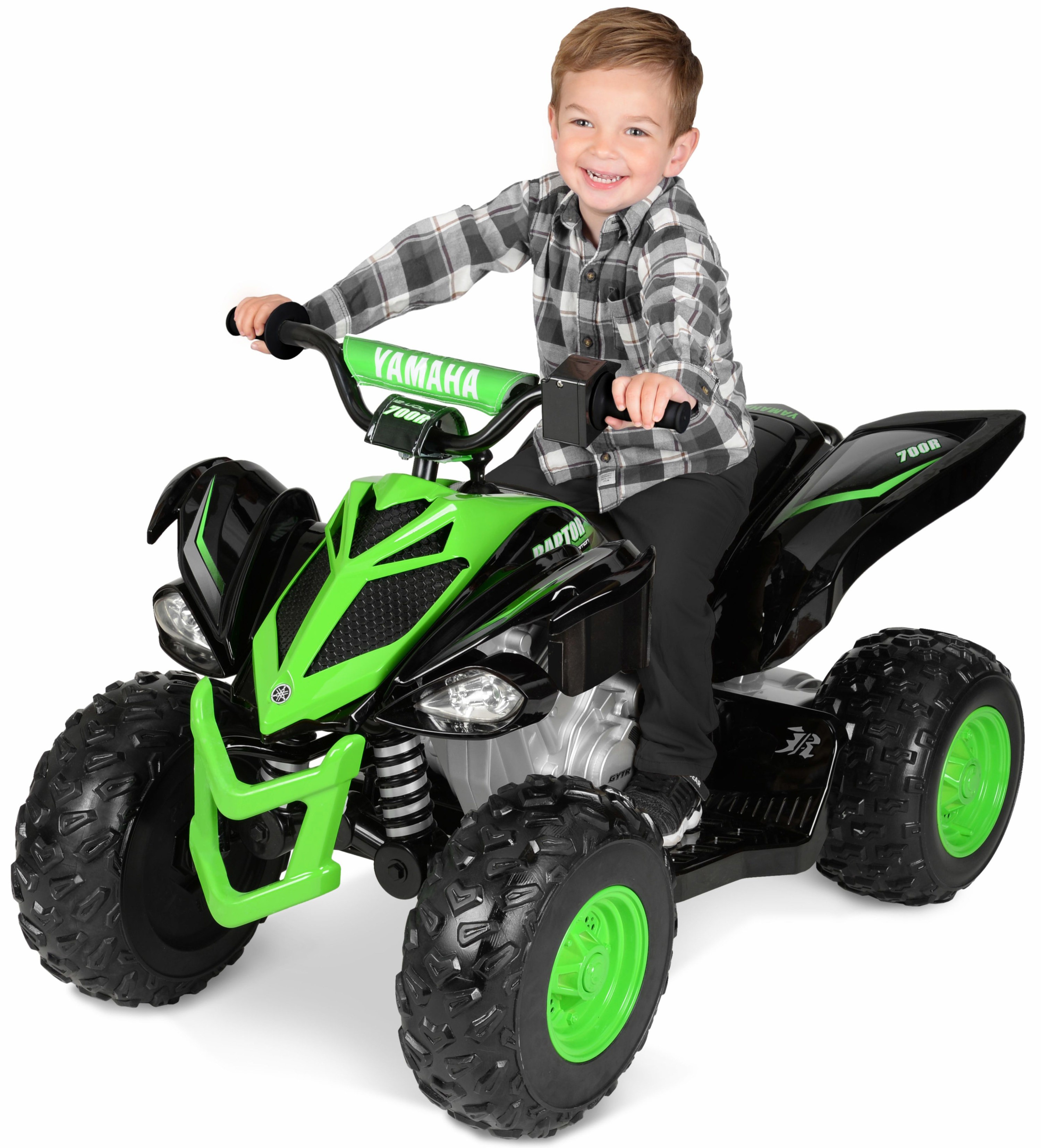 A child riding the green toy