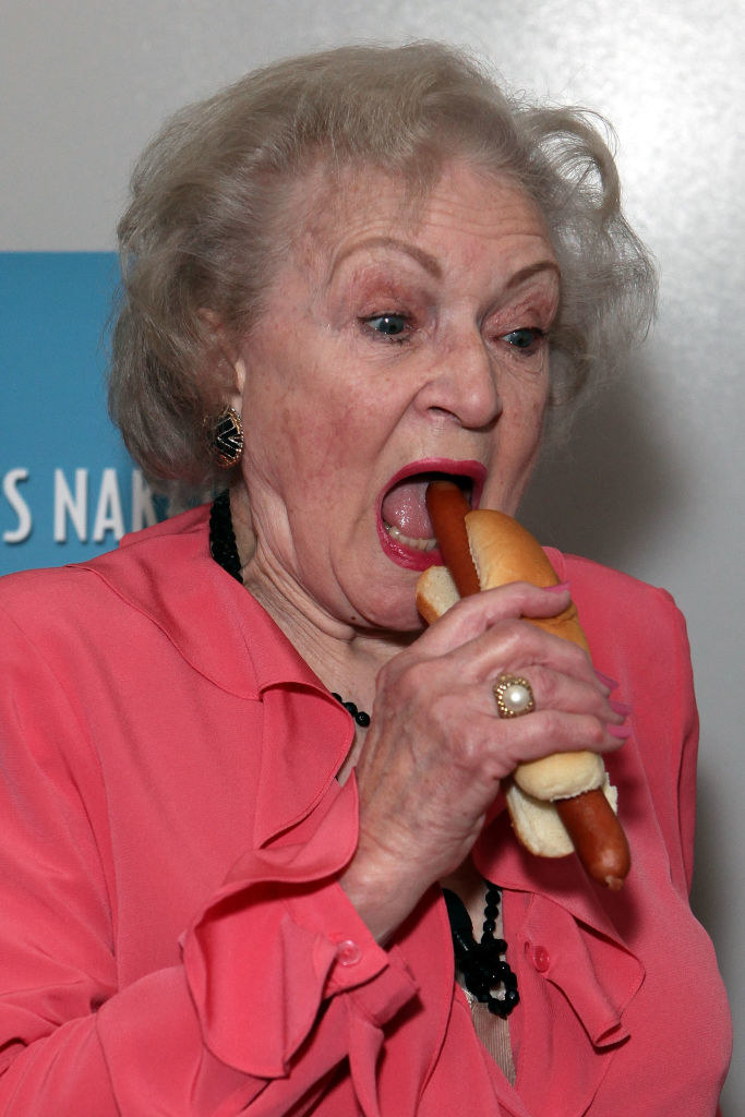 Betty going in for a big bite of a hot dog