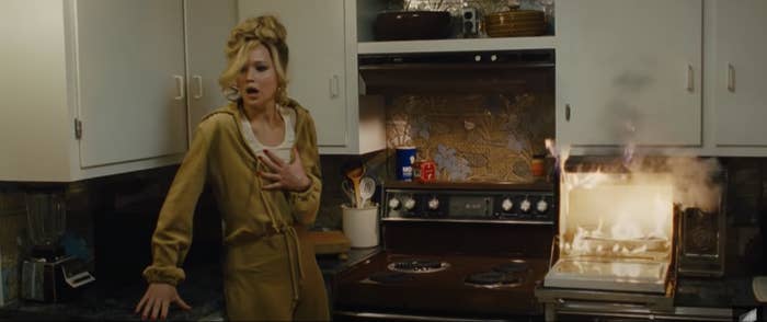 Jennifer Lawrence catching an oven on fire in American Hustle
