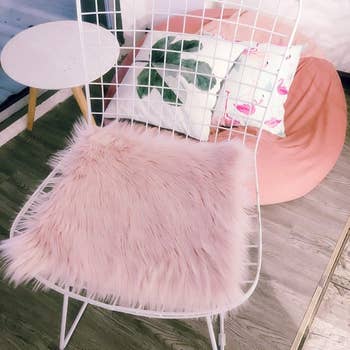 The faux fur cover in light pink