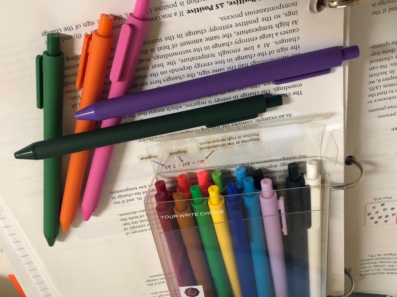 A reviewer&#x27;s photo of the multi-colored pens