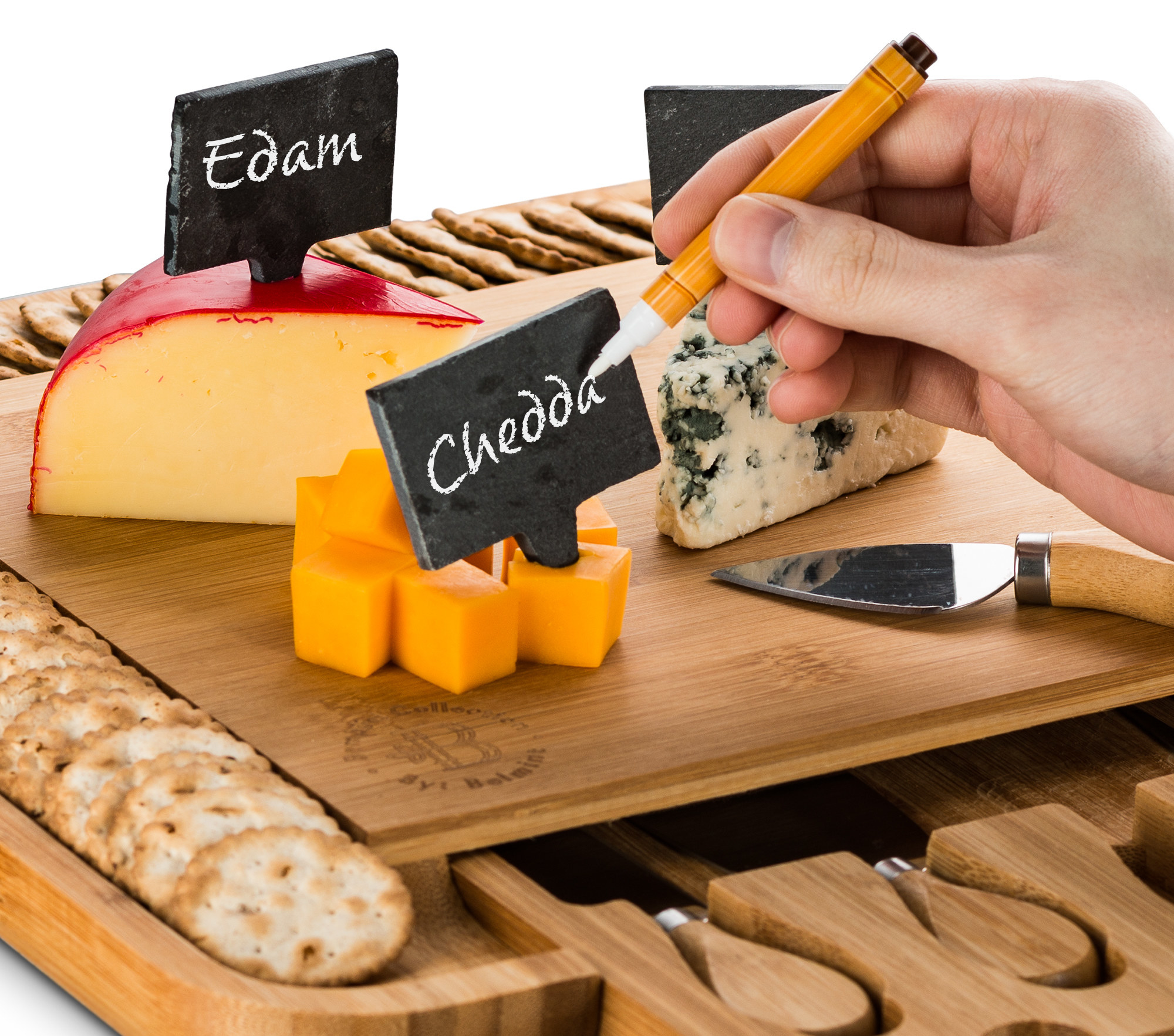 The cheese board and labels with someone writing on the labels