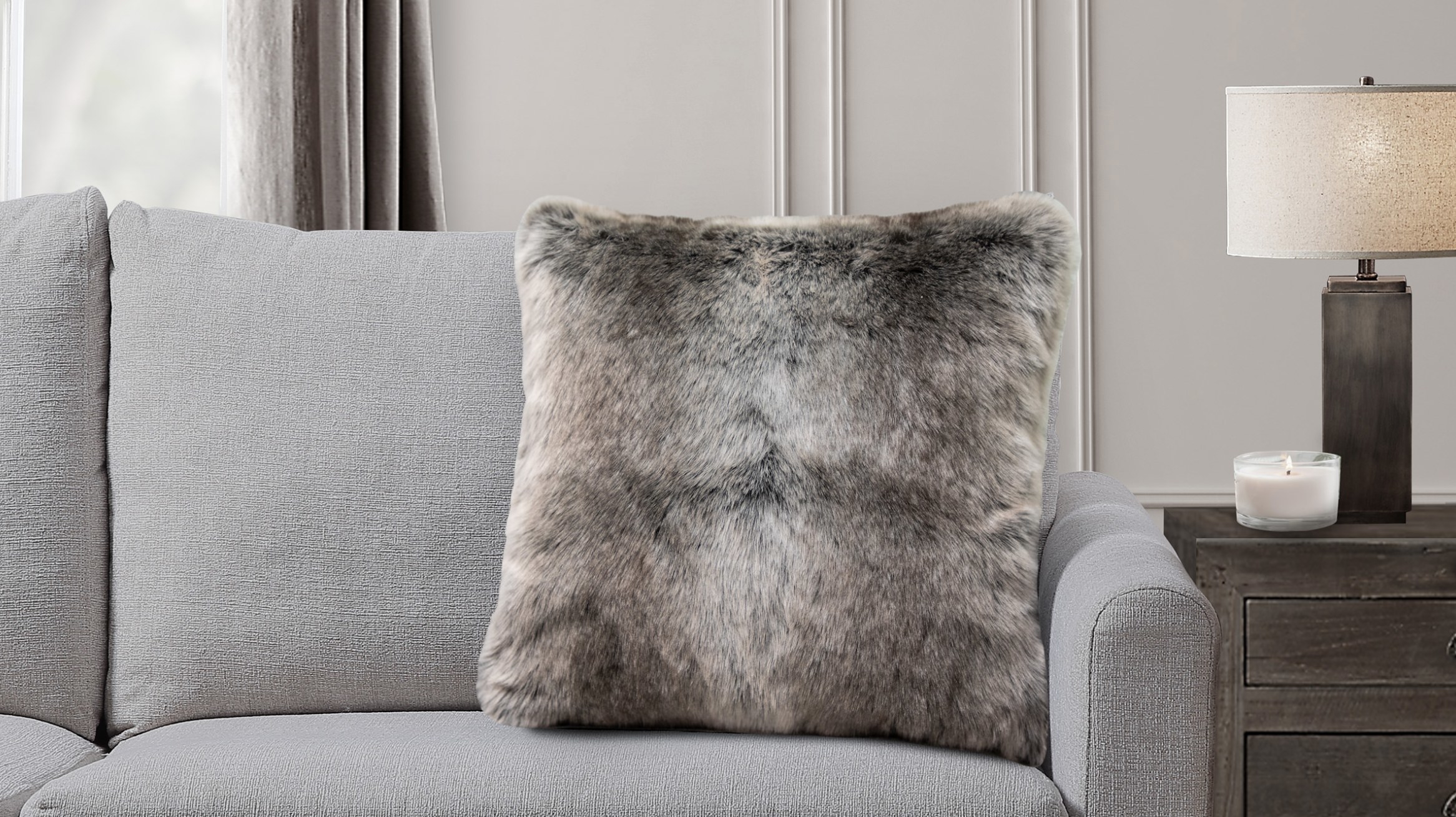 The pillow on a grey couch