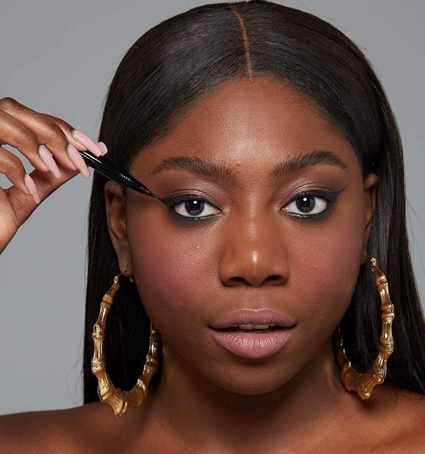 A person applying the liner