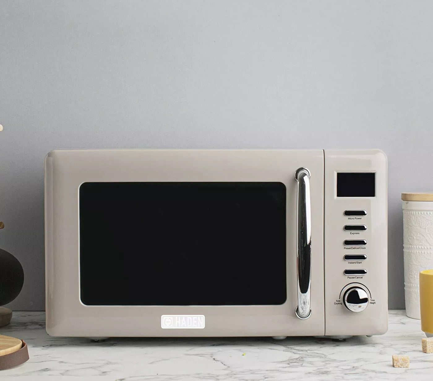 The microwave sitting on a marble countertop
