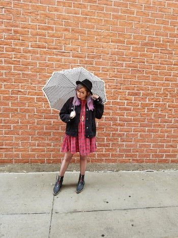 reviewer wearing the dress in red plaid