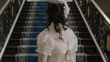 Claudia Jessie in the TV show &quot;Bridgerton&quot; twirling in a party dress