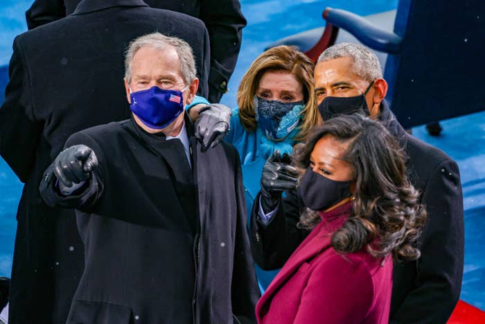 George W. Bush in a blue face mask with an American flag, Nancy Pelosi in a blue floral face mask, Barack Obama and Michelle Obama in black face masks at the inauguration of U.S. President-elect Joe Biden. 