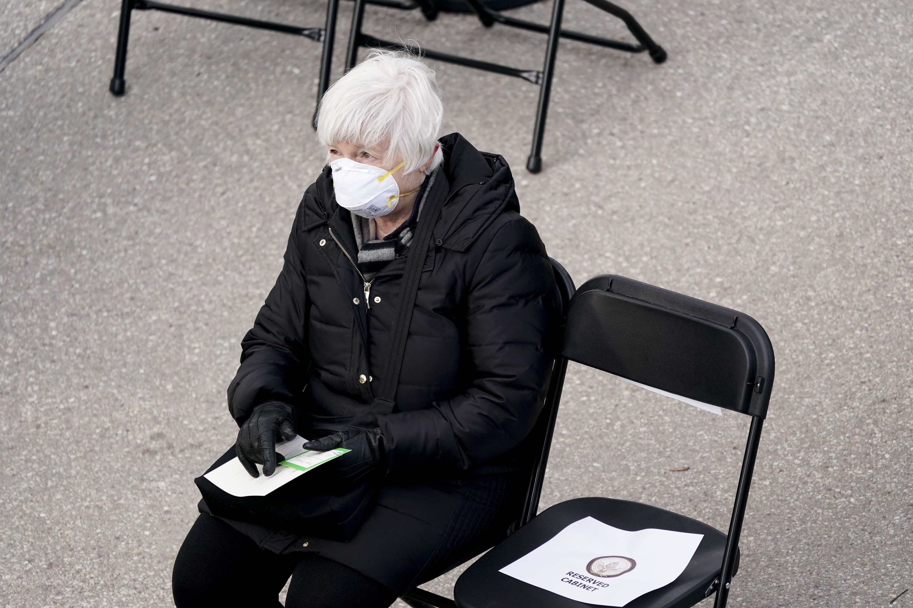 Janet Yellen, seated in an N-95 mask and black jacket, at the inaguration.