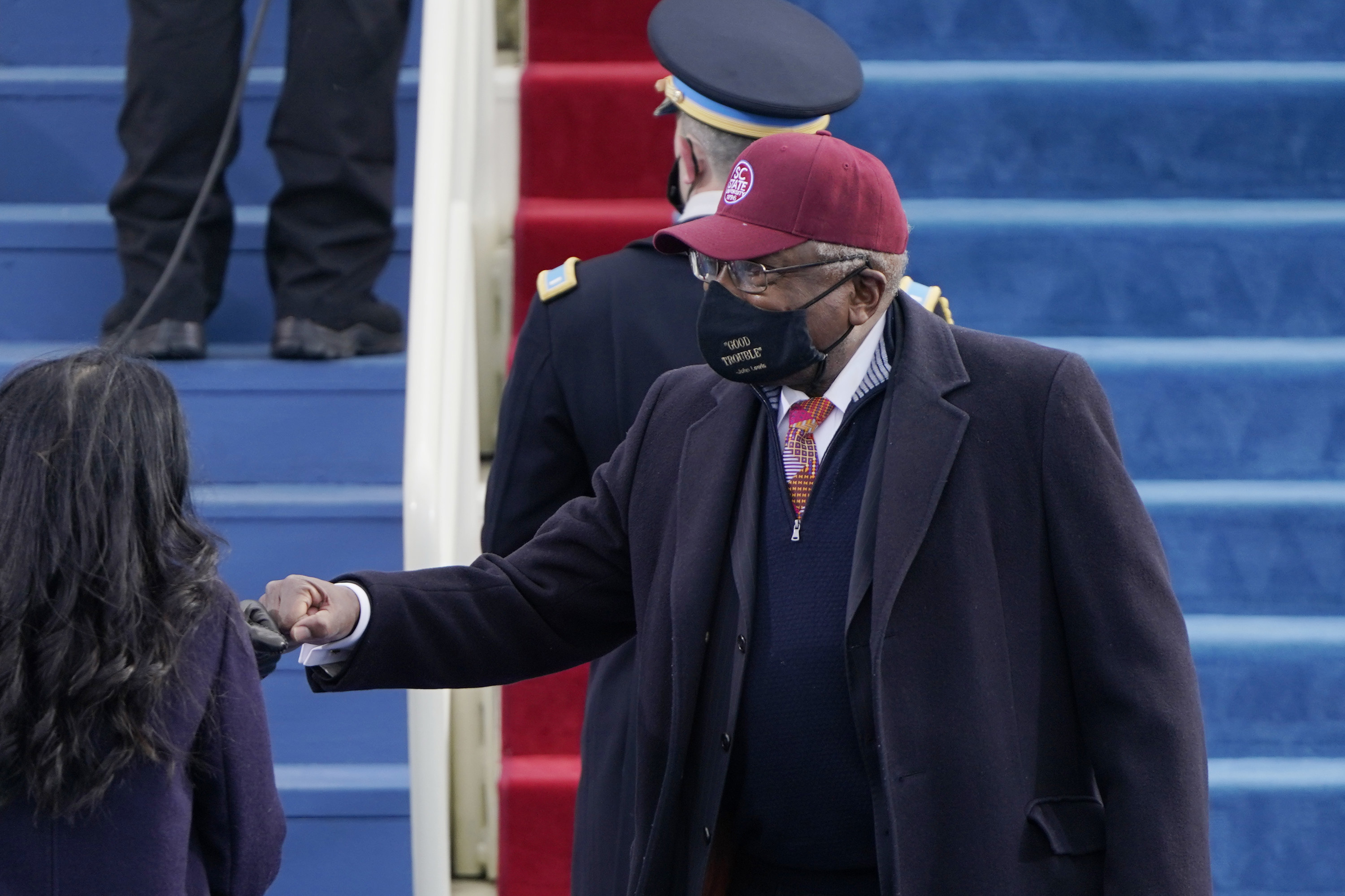 House Majority Whip James Clyburn wearing a black mask with &quot;Good Trouble&quot; printed on it at the inauguration. 