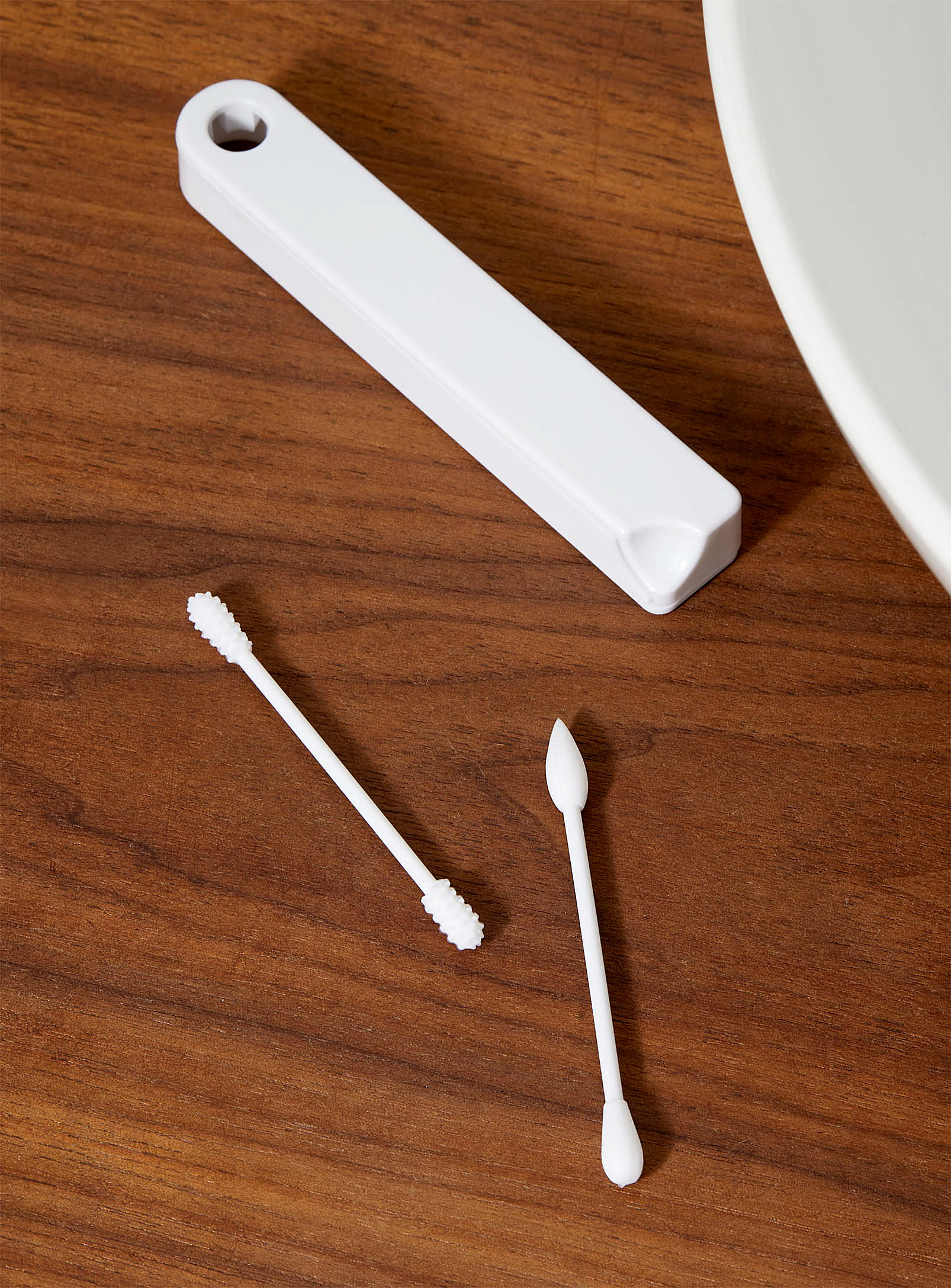 the silicone swabs on a table next to the carrying case