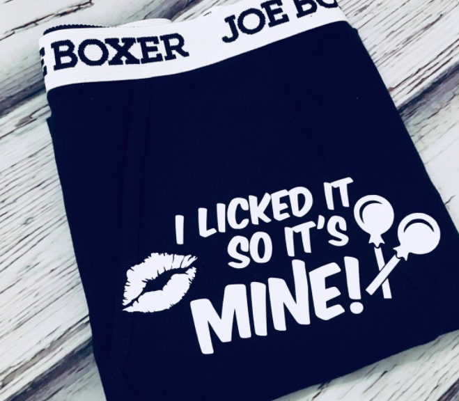 A pair of boxers with the words I licked it so it's mine screen printed on them