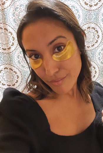 buzzfeed writer with gold eye masks on