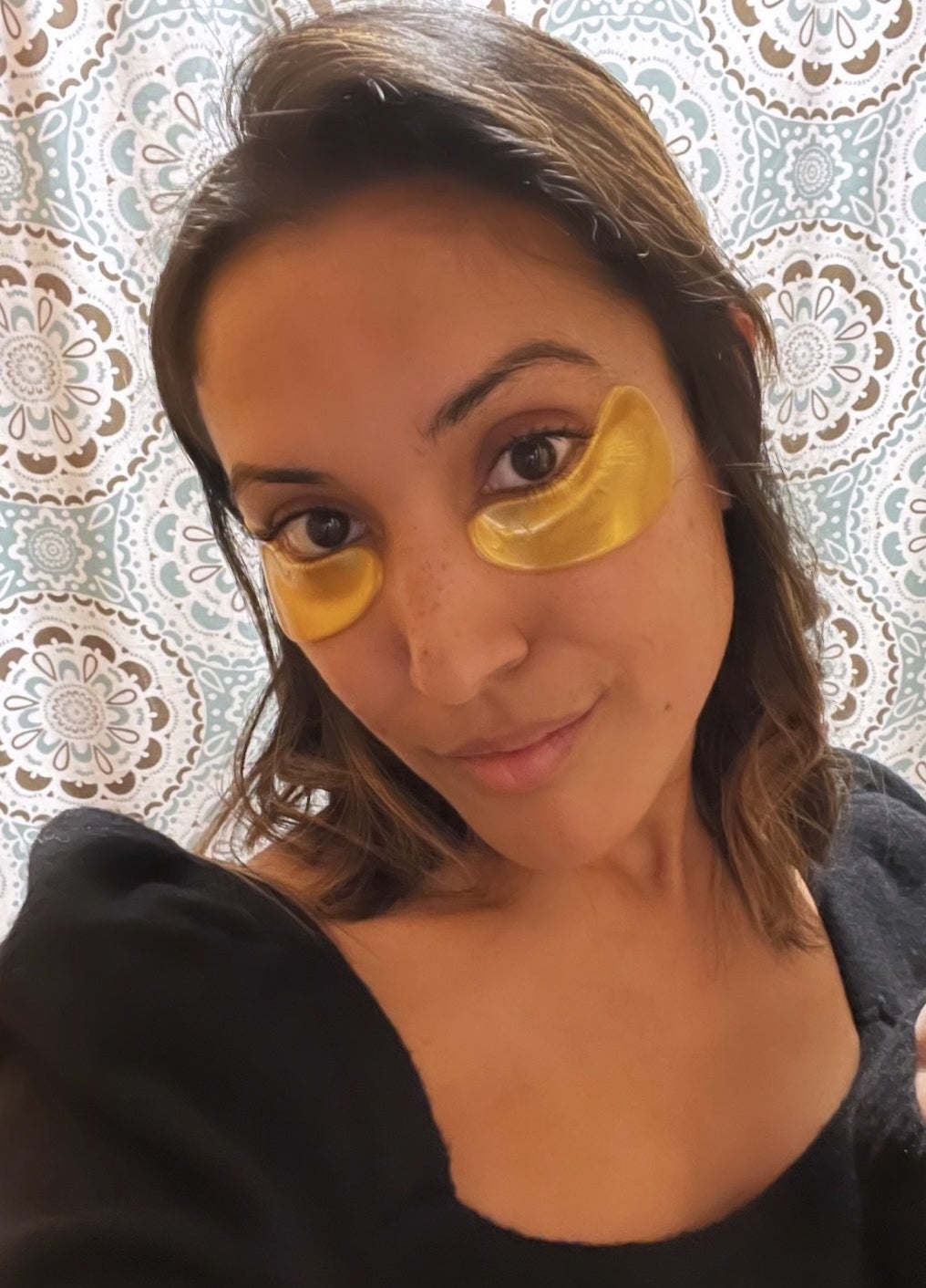 buzzfeed writer with gold eye masks on