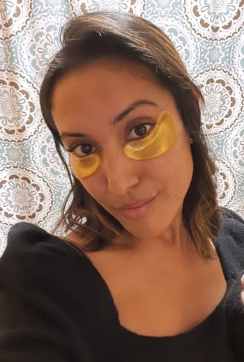 buzzfeed writer with gold eye masks on