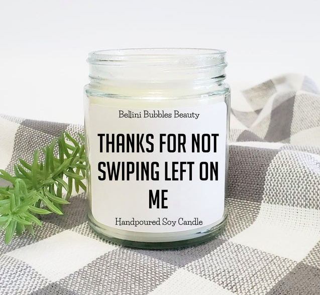 A jar candle with a label that says "thanks for not swiping left on me"